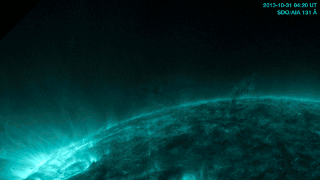 Note the tiny jet of material that leads into the flare on the left and ultimately the wave. Credit: From Quarks to Quasars; NASA SDO