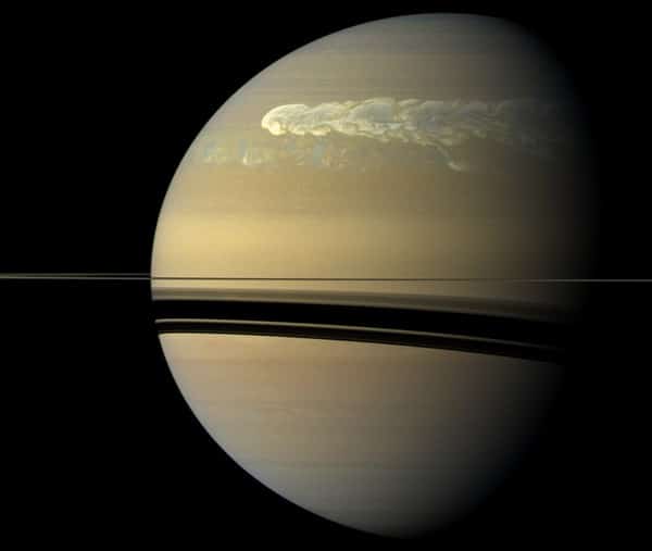 The huge storm churning through the atmosphere in Saturn’s northern hemisphere overtakes itself as it encircles the planet in this true-color view from NASA’s Cassini spacecraft. Image credit: NASA/JPL-Caltech/SSI