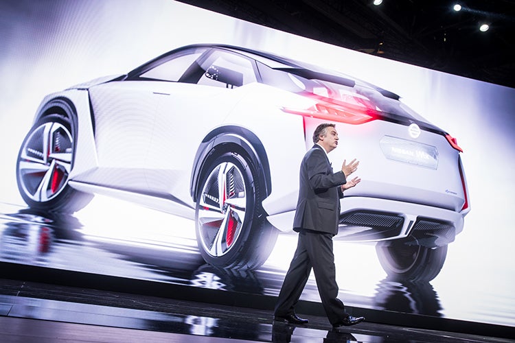 Daniele Schialli unveils the Nissan IMx concept, which will be a singing electric car feature, at the Tokyo Motor Show. 