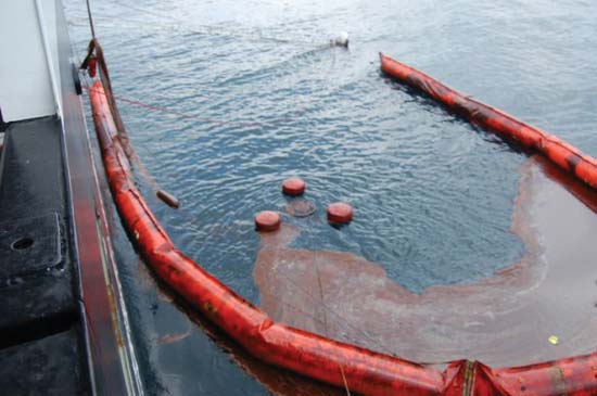 U.S. Coast Guard collecting oil using a skimming boom. Image Credit: U.S. Department of Defense