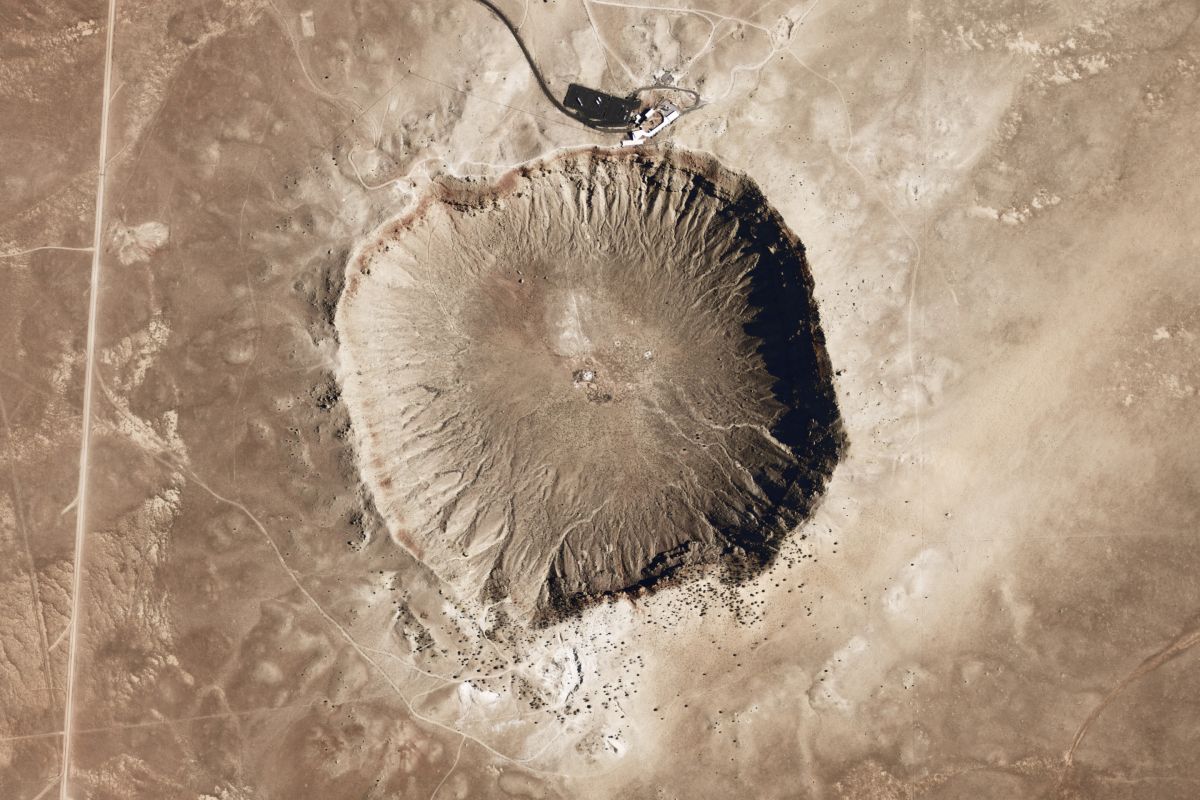 Space-based image of an extraterrestrial crater. This research shows that the building blocks of life could form in inhospitable vacuum conditions like these.