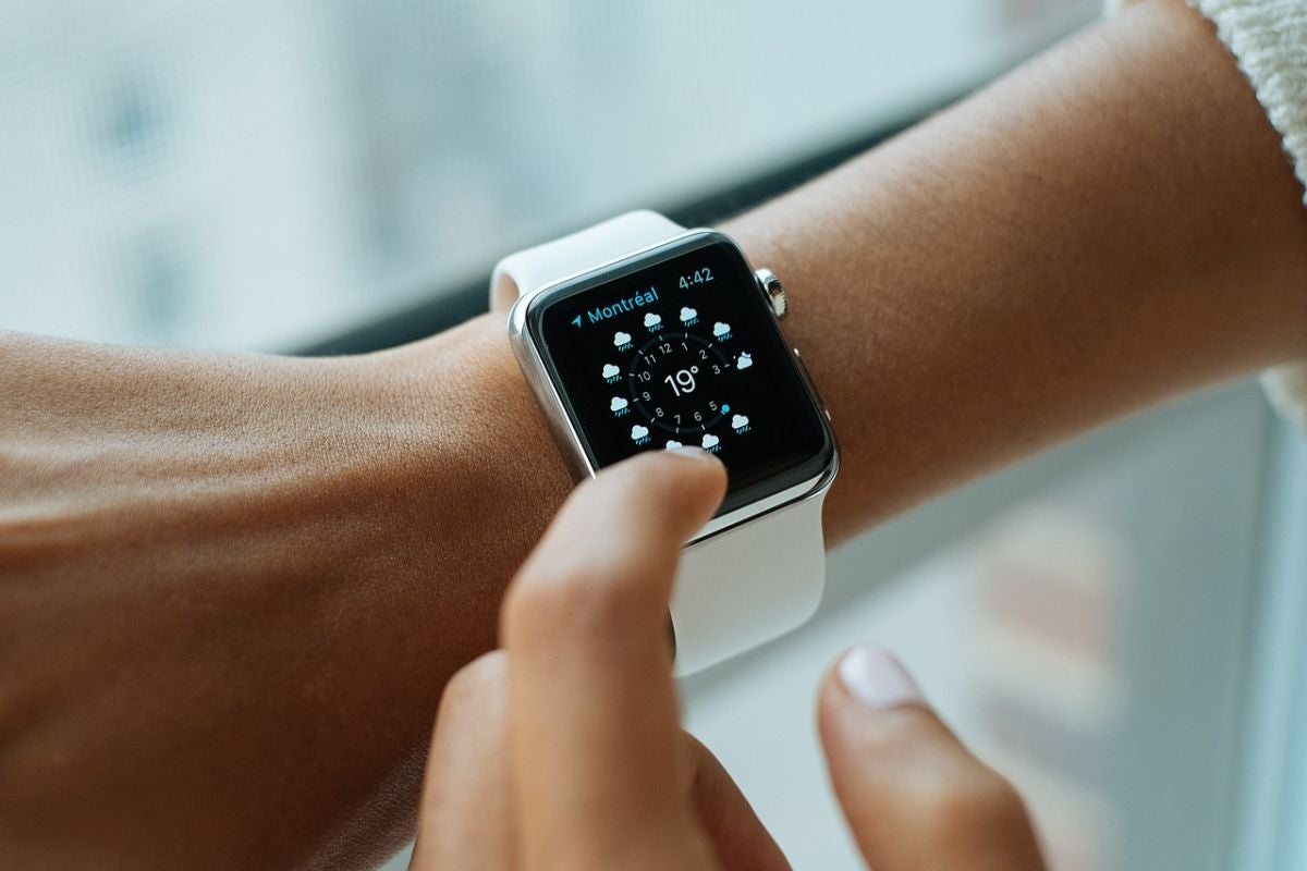 A person's wrist as they check the weather on a smart watch. As more internet of things devices like this come online, we may need a new frequency range to support them.