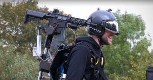 Gravity Industries added a shoulder-mounted toy rifle to its Iron Man-style flying jet suit, and then took it for a spin above a parking lot.